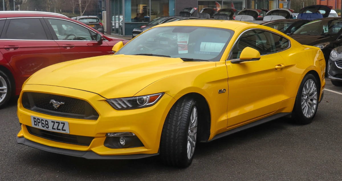 The same yellow car before the plate was blurred